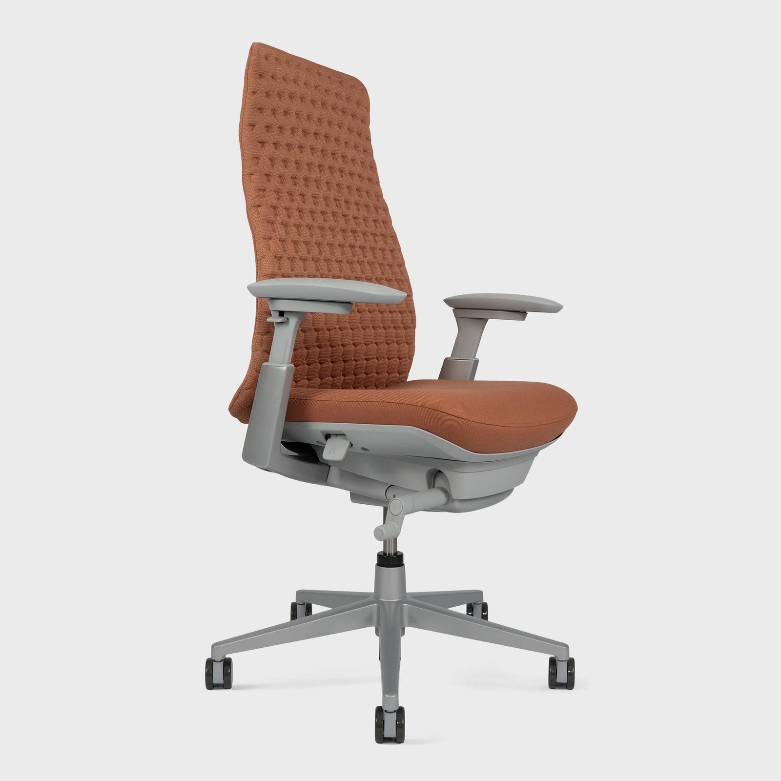Side view of Fern Digital Knit Office chair in colour Emberglow without lumbar support